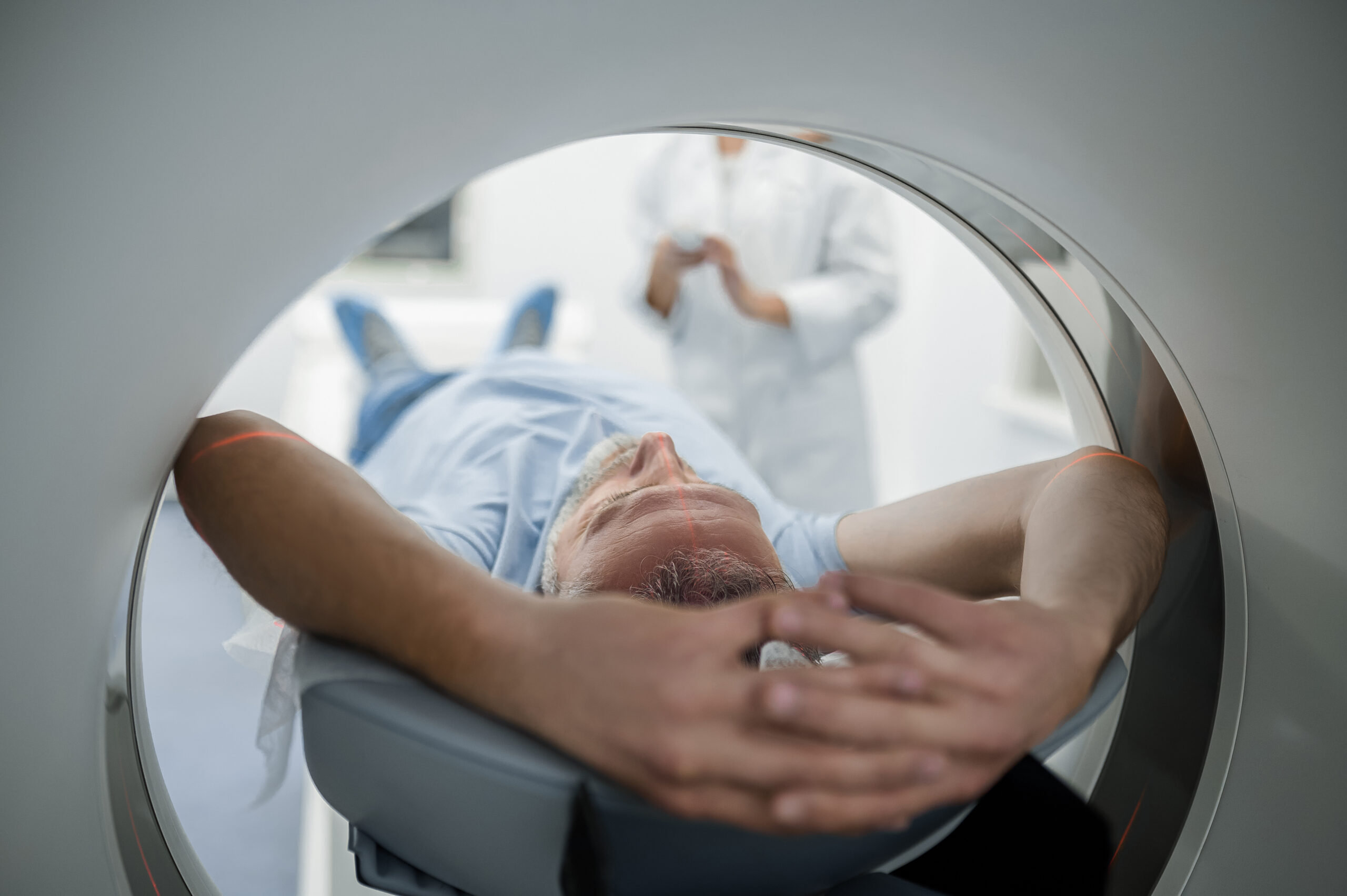 Photo of a patient with metastatic lung cancer inside an MRI machine