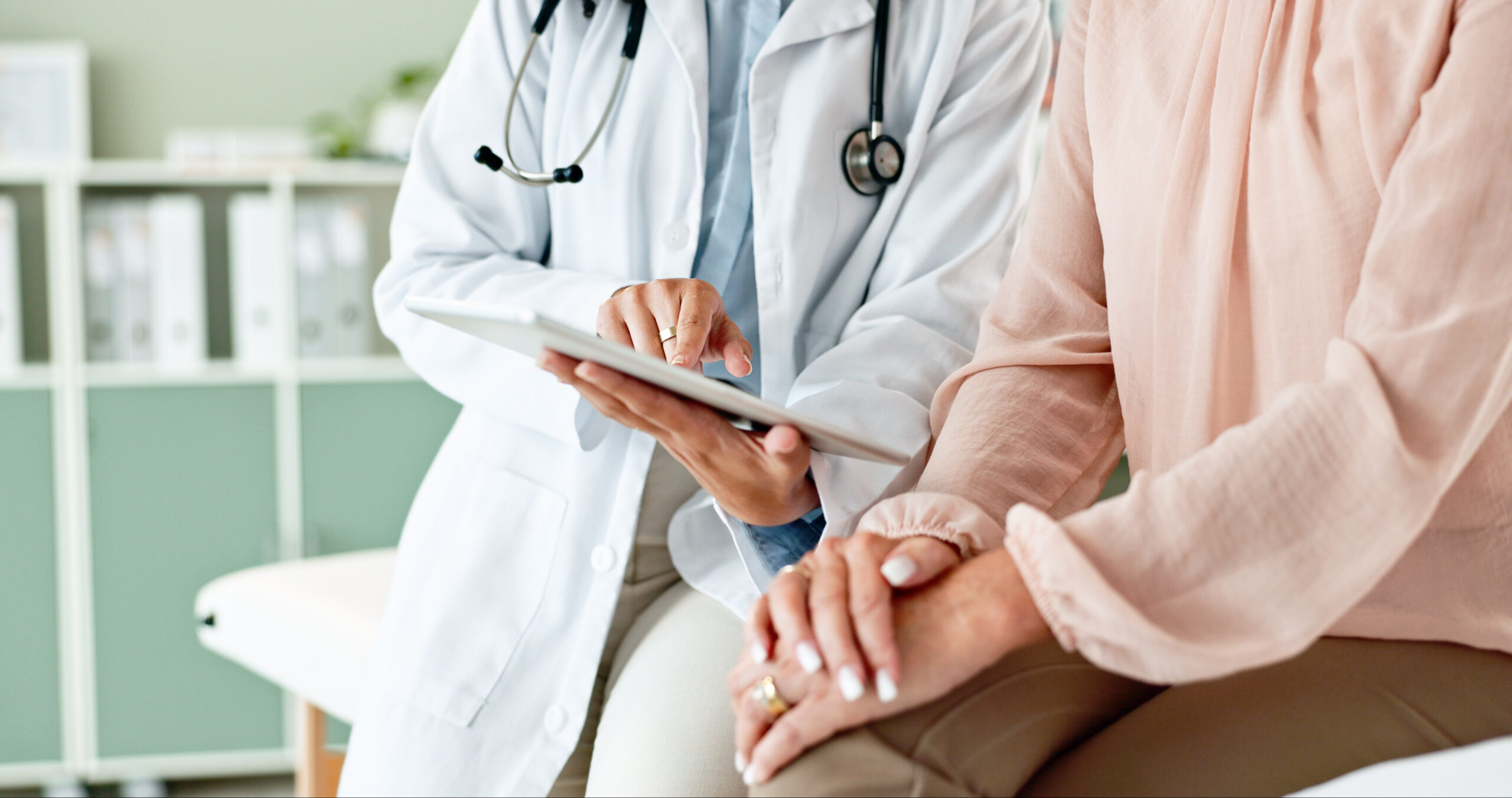 A photo of a medical provider discussing soft tissue sarcoma with a patient