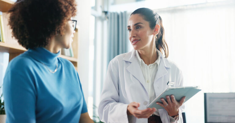 A photo of a woman speaking with a provider about leiomyosarcoma